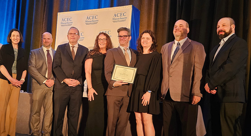 SMMA project team members accepting an engineering award for Somerville High School